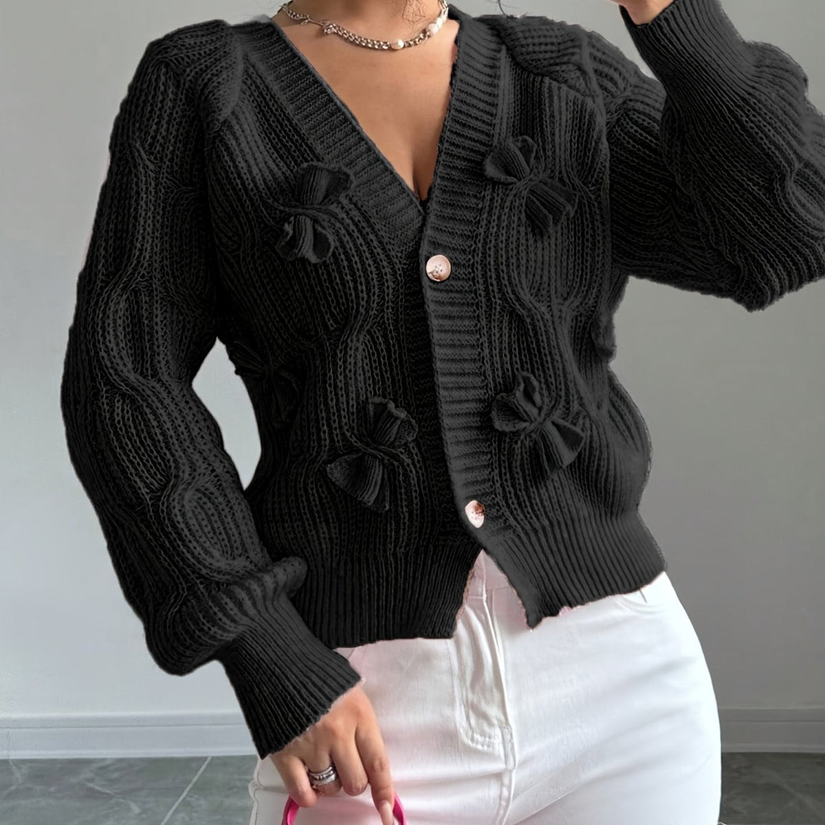 Feminine Cable-Knit Cardigan with Bow Details in Black