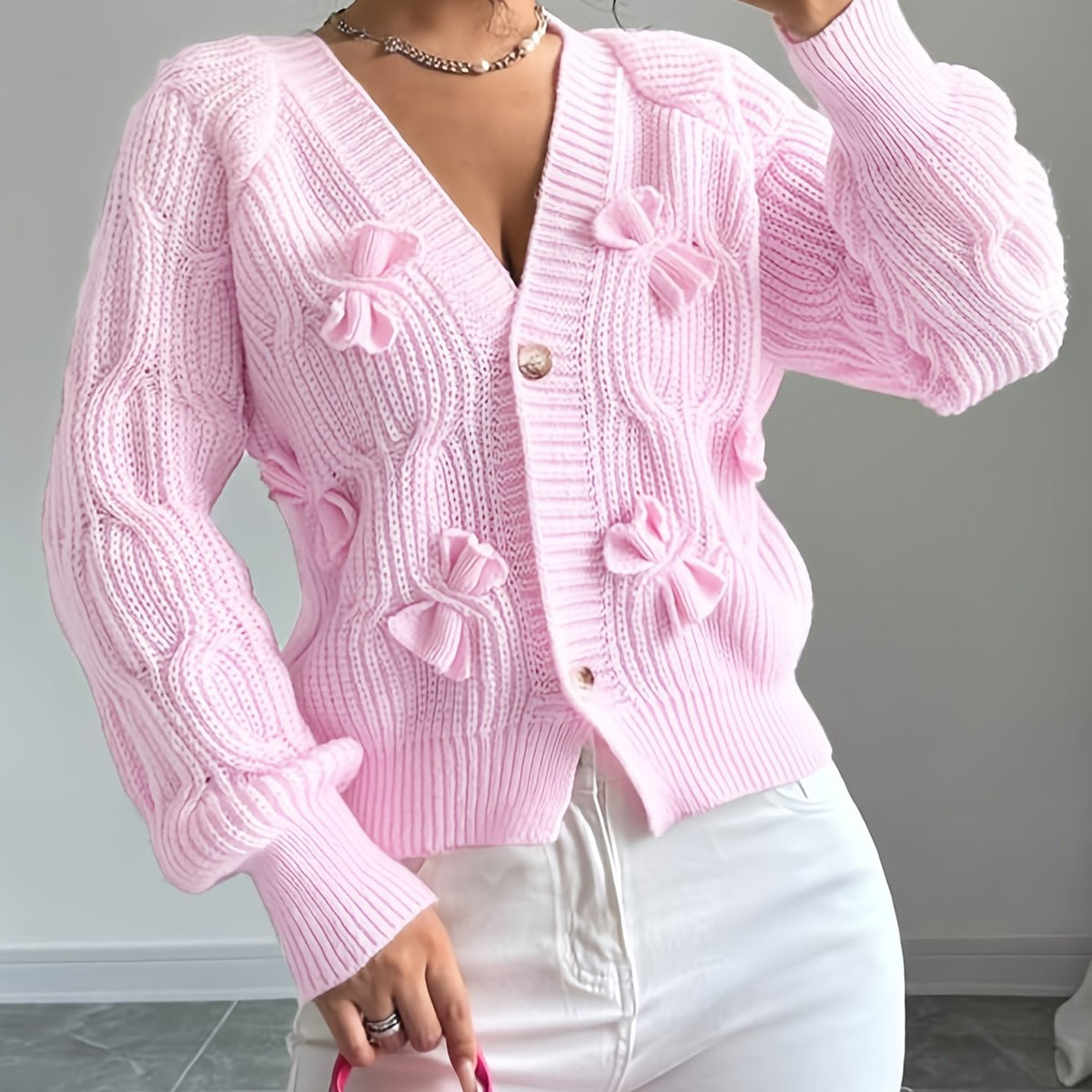 Feminine Cable-Knit Cardigan with Bow Details in Pink